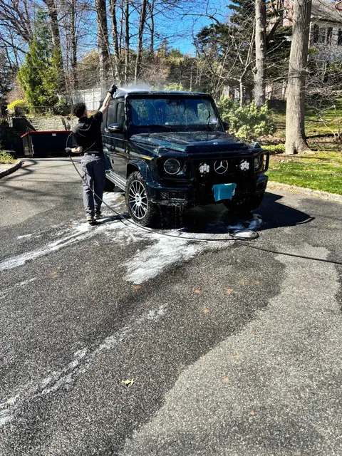 Mercedes G-Wagon being pressure rinsed during a mobile detail